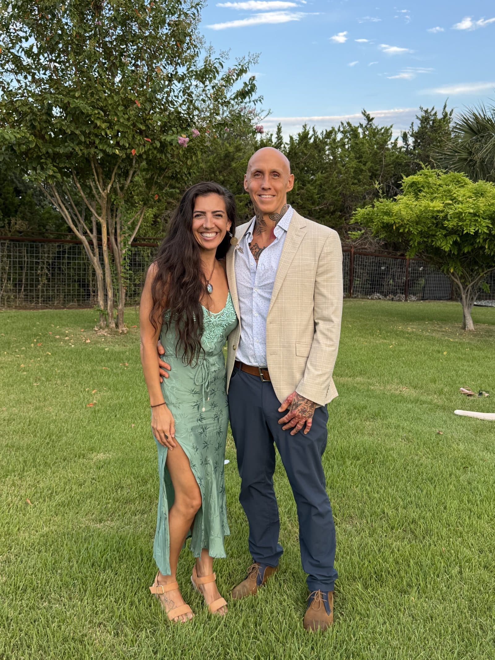 Sam Morris and his partner standing together on a lawn