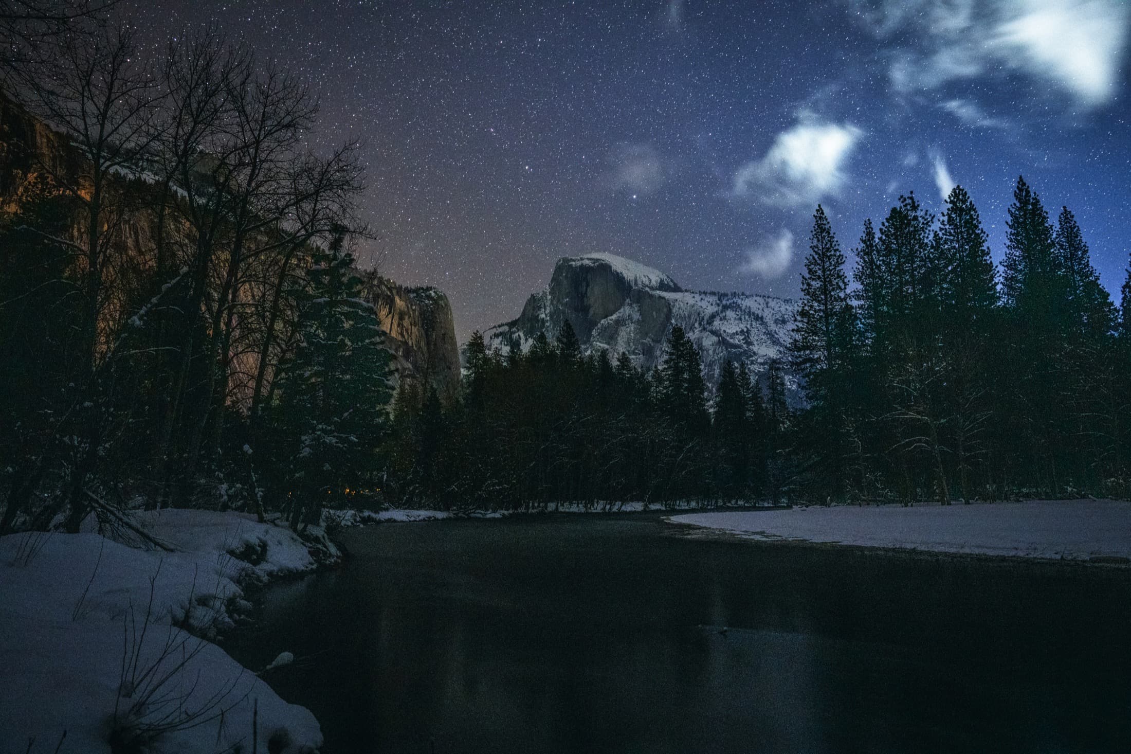 A snow-lit peak beneath a field of stars