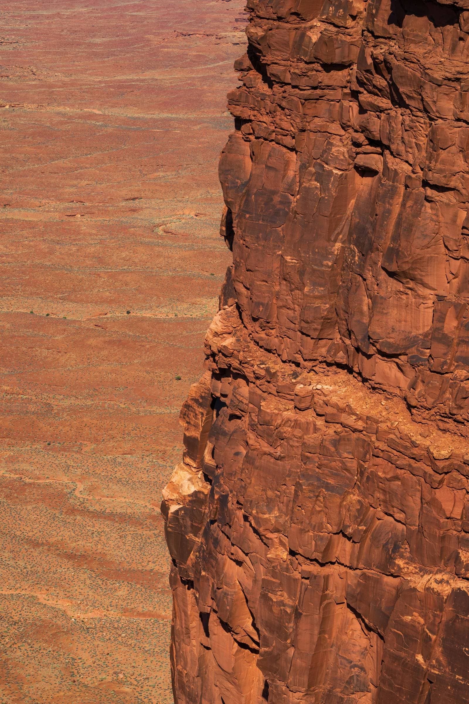 A red rock wall in the Arizona desert, layered by time.