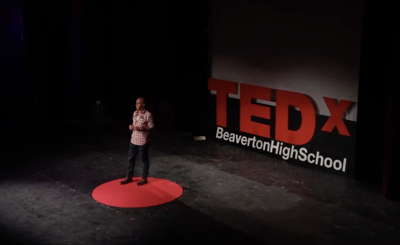 Sam Morris speaking on the TEDx stage